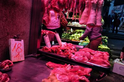 Group of people for sale at market stall