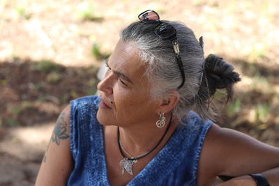 Portrait of woman looking away outdoors