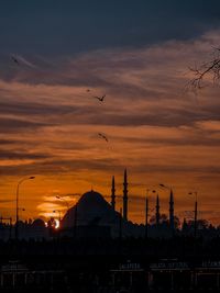 Low angle view of mosk silhouette against sky during sunset