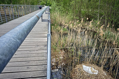 Wooden footbridge on footpath