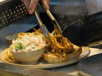 Close-up of man preparing food