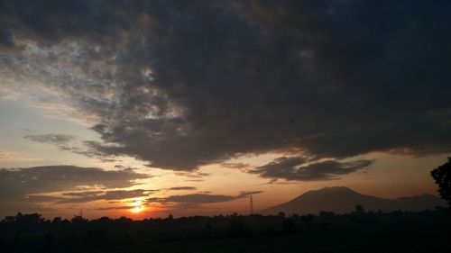 Scenic view of dramatic sky during sunset