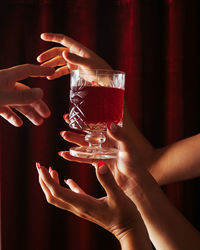 Close-up of hand holding drink