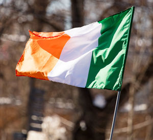 Low angle view of flags against the sky