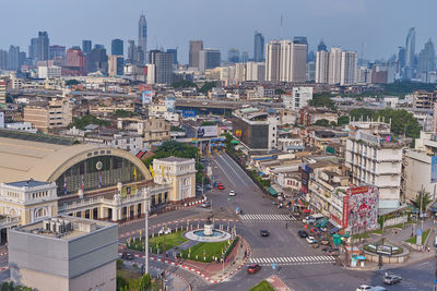 High angle view of street amidst buildings against sky