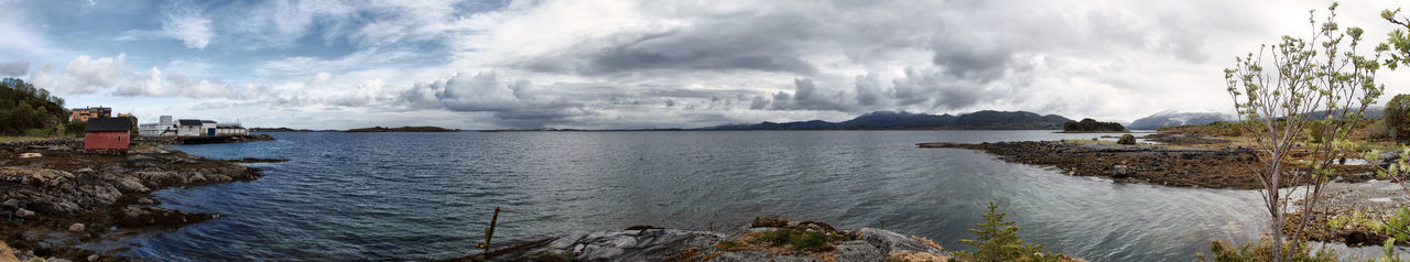 Panoramic view of bay against sky