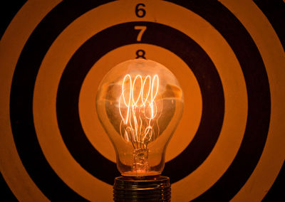 Low angle view of illuminated light bulb