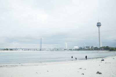 View of beach against cloudy sky