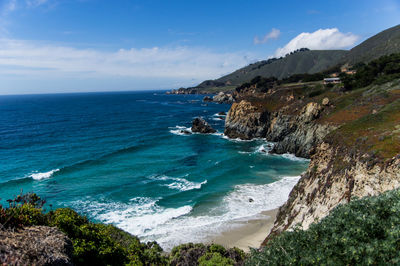 Scenic view of sea against blue sky