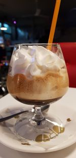 Close-up of coffee in glass on table