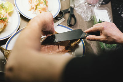 Midsection of man preparing food