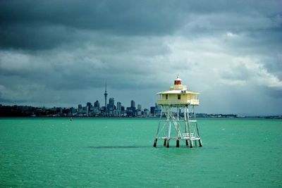 Scenic view of calm sea against cloudy sky