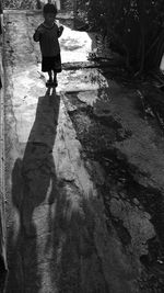 High angle view of boy standing on land