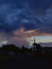 Cars on road at sunset