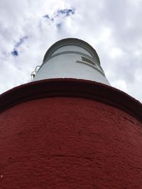 Low angle view of building against cloudy sky