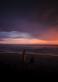 Blue hour scene with dramatic sky and couple enjoying the view