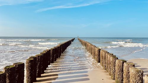 Pier over sea against sky