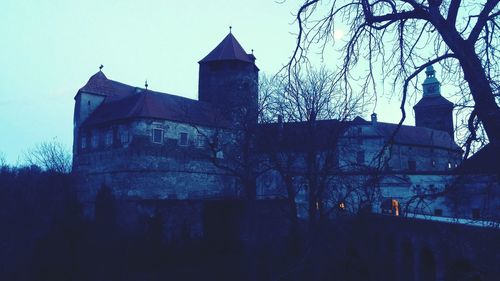 Low angle view of church against sky during winter