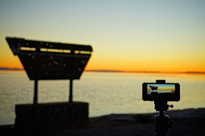 Mobile phone on tripod at bonneville salt flats during sunrise