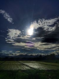 Scenic view of landscape against cloudy sky