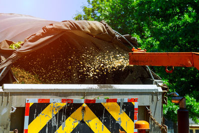 Garbage truck against trees