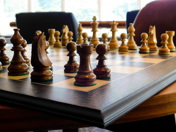 Close-up of chess pieceson board