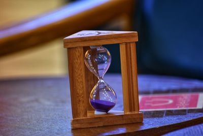 Close-up of hourglass on table