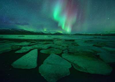 Beautiful aurora over famous diamond beach at night,night landscape, iceland