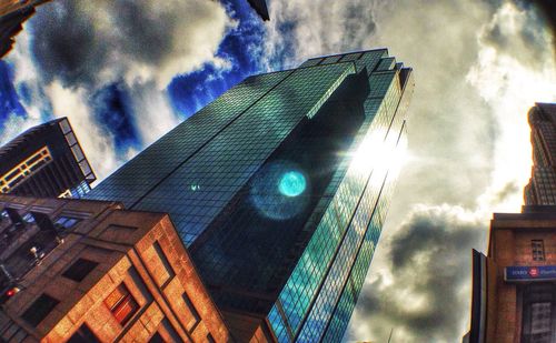 Low angle view of building against cloudy sky