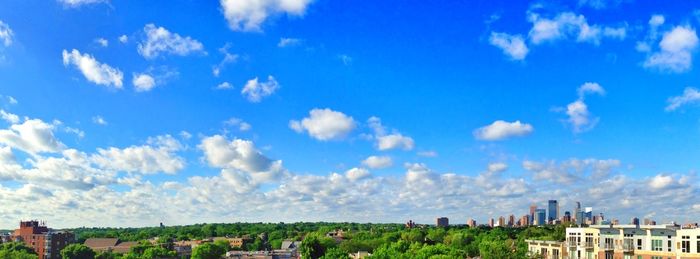 View of cityscape against blue sky