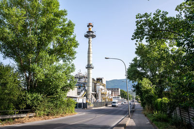 Street by road against sky