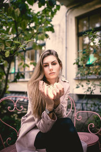 Young woman sitting outdoors