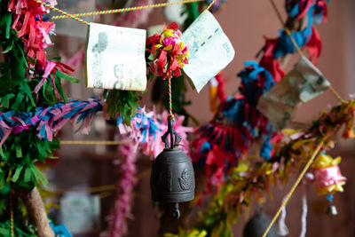 Close-up of various hanging for sale at market stall