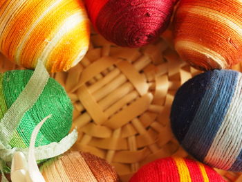 Close-up of easter eggs wrapped in threads