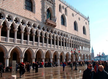 Group of people in front of historical building