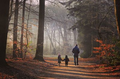 Man and children in forest