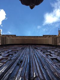 Low angle view of roof against sky