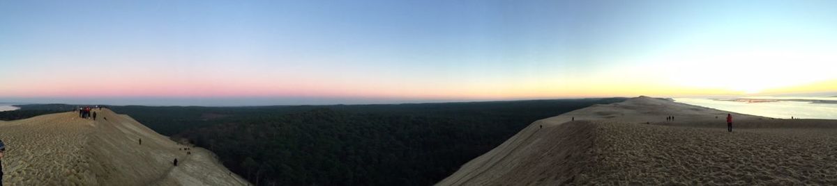 Scenic view of landscape against sky at sunset