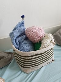 Close-up basket of wool yarn knitting 