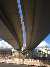 Low angle view of bridge in city
