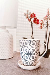 Close-up of vase on table at home