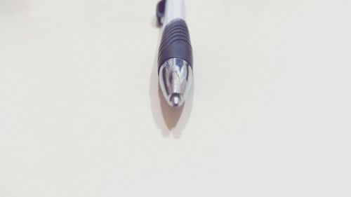 High angle view of pen on table against white background