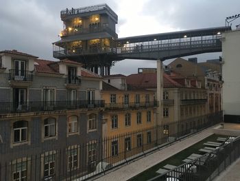 Low angle view of buildings against cloudy sky