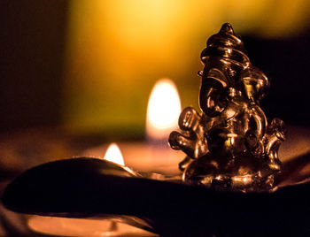 Close-up of ganesha statue on table