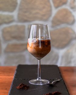 Close-up of wine in glass on table