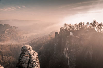 Panoramic view of rock formations against sky