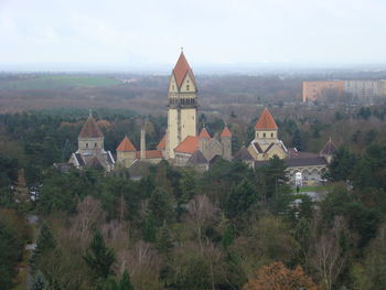 High angle view of trees and buildings against sky