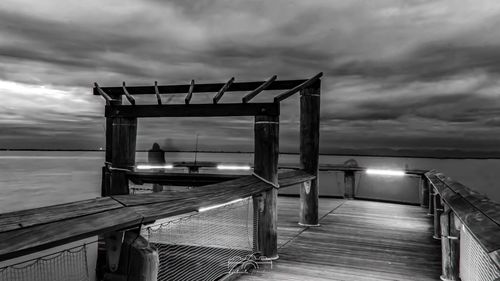 Pier over sea against sky