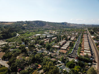 High angle view of trees and buildings against sky