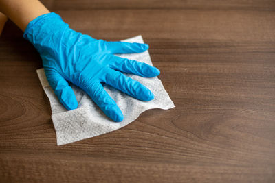 Close-up of human hand on table